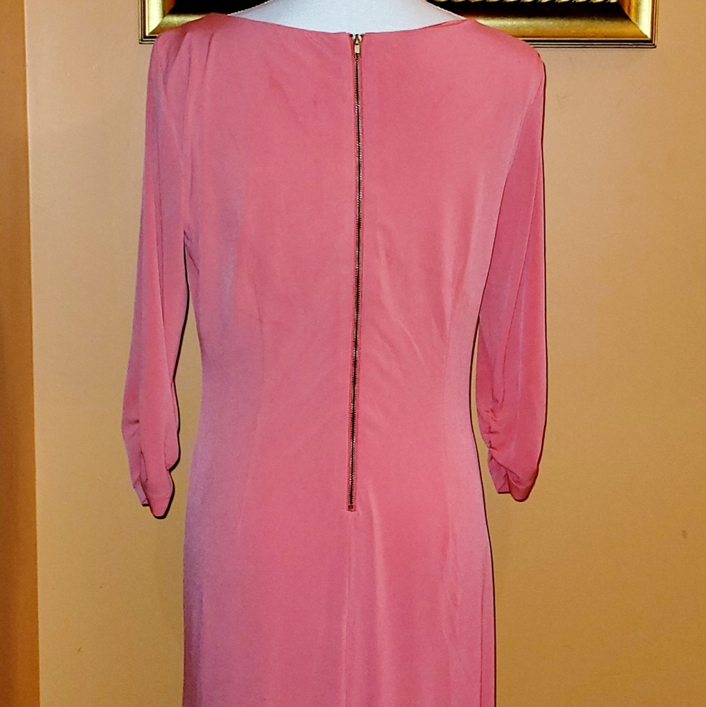 Peach color dress.
